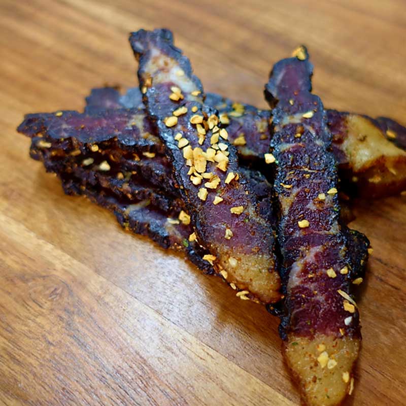 closeup photo of moist garlic flavoured biltong